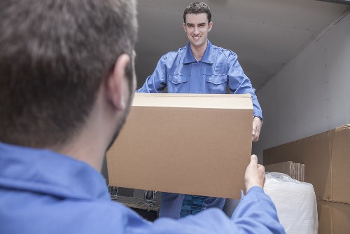 Moving team supporting a Brompton home relocation with boxes and furniture