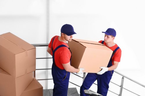 Flat removals team handling a move in a Brompton apartment building