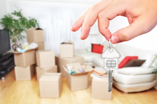 Careful loading of boxes and household items into a van in Brompton