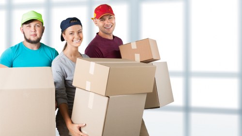 Packed office furniture and equipment ready for transport in Brompton