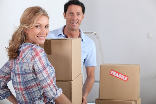 Relocation team organising boxes and workstations during a Brompton office move
